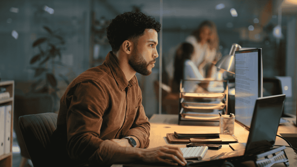 Image depicts a finance leader calculating the ROI of AP automation