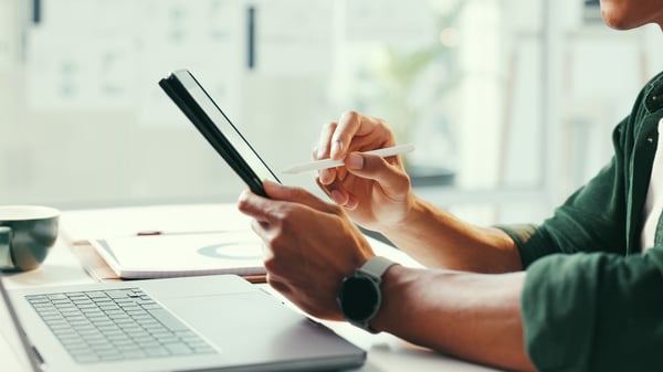 Shows an HR professional handling absence management software