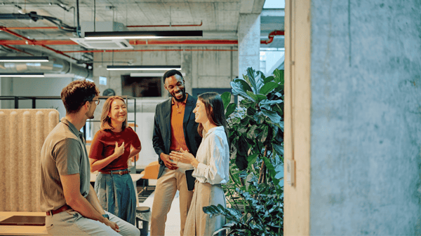 Image depicts payroll leaders discussing workday-native payroll integration